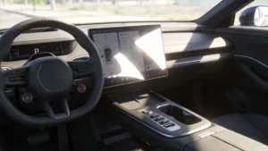 Automotive touchscreen in direct sunlight showing glare and readability challenges